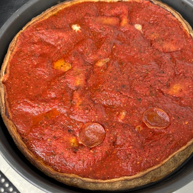 Indulge in Our Deep Dish Pizza